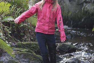 Molly stands in a stream