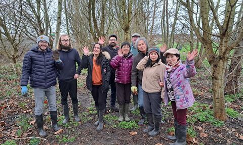 Group of people in woodlands in the winter. 