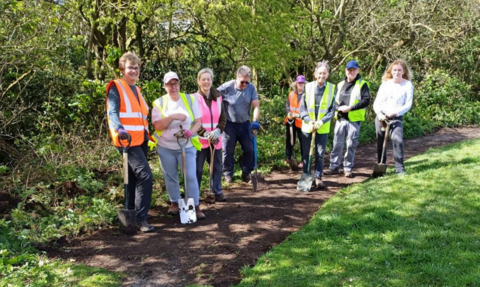 A group of volunteers in a woodland