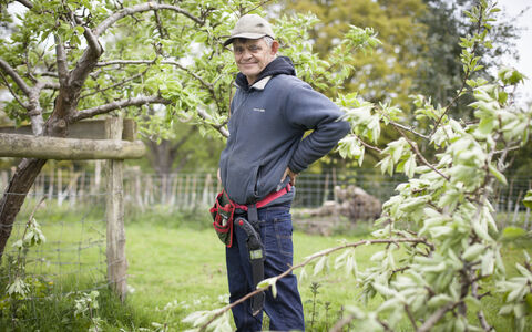 Martin stands in a garden