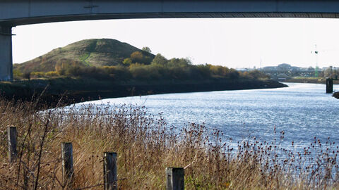 A river with a large bridge over it