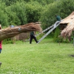 Using phragmites water reed to thatch roundhouse